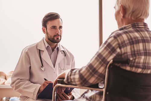 a doctor at a substance abuse treatment center talks to a patient