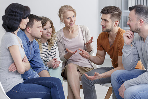 Addiction Treatment In Idaho group of clients talking at an addiction treatment in Idaho